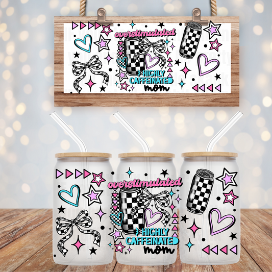 A collection of decorative stickers with various designs, including hearts and stars, applied on white cups displayed on a wooden surface against a blurred background.